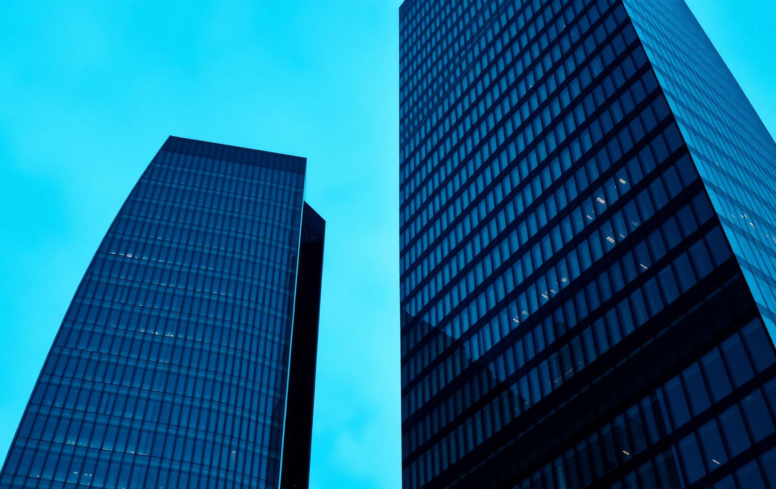Twin financial district towers at blue hour