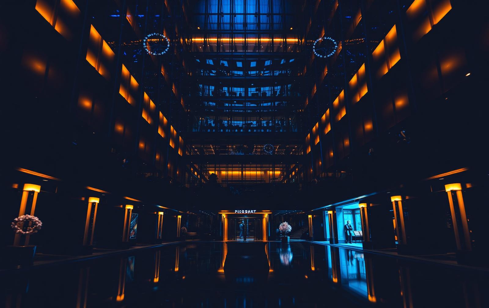 Luxury hospitality atrium illuminated at night